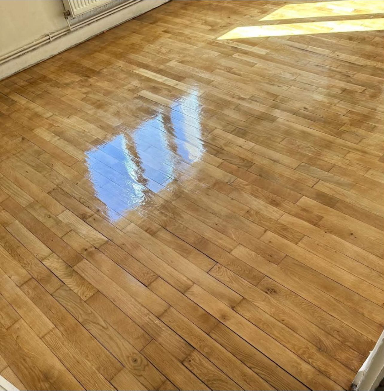 Parquet rénové après ponçage et vitrification